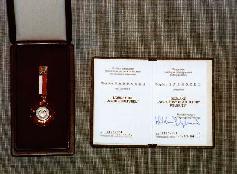 Picture of Bogdan Paprocki's Merit decoration to Polish culture by Waldemar Dabrowski, culture minister